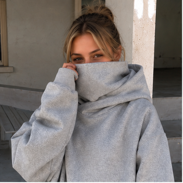 Large hoodie covers lower face